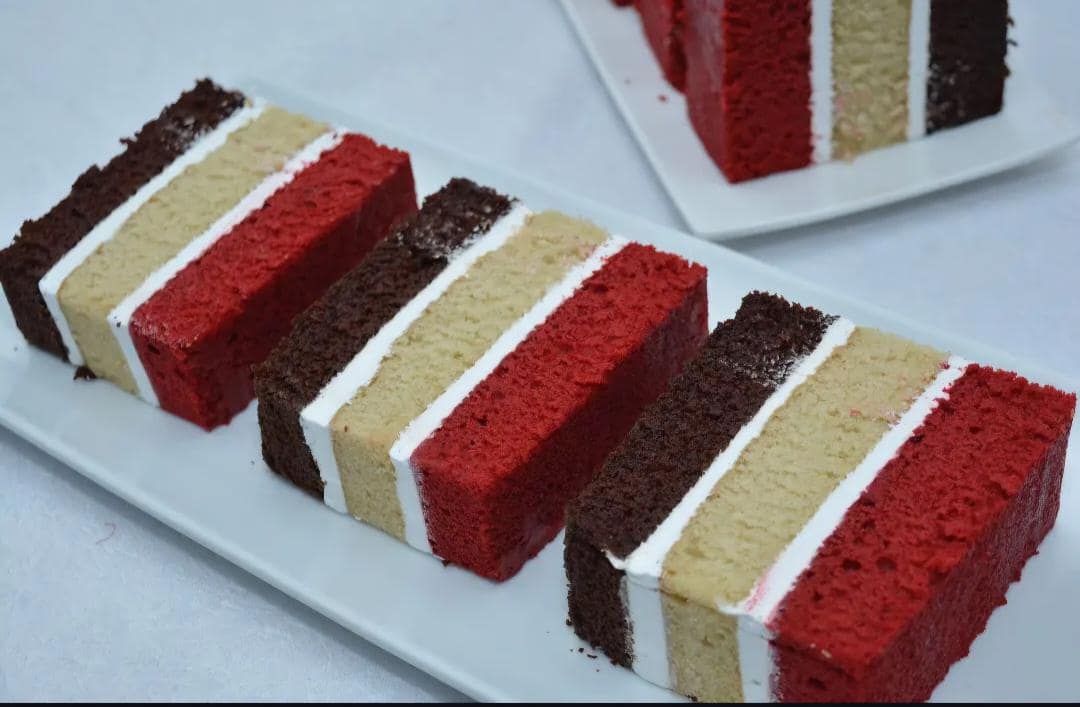 Layered cake slices plated neatly